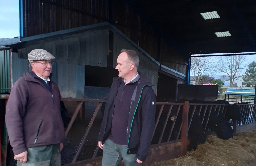 Neil & Farmer in cow shed