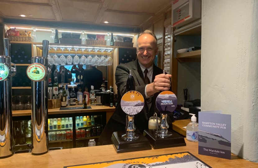 Dr Neil Hudson MP pulling a pint