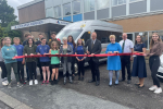 Dr Neil Hudson MP cutting the ribbon for Alston's newest bus