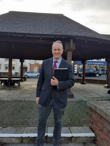 Image of Dr Neil Hudson MP outside Penrith bandstand